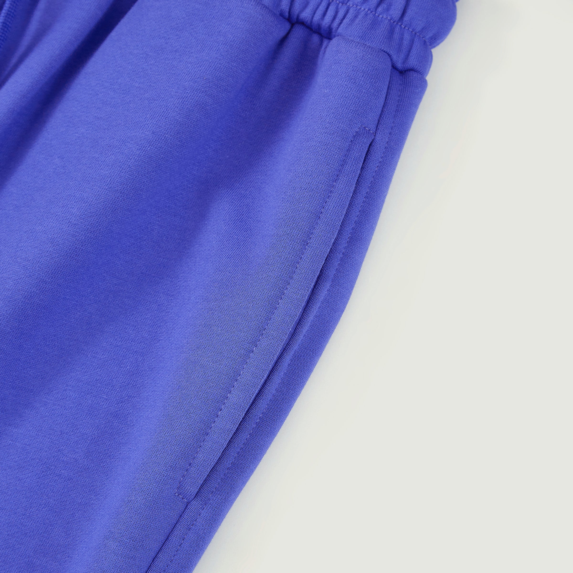 Editorial side view of the MR. HAPPINESS "Mind Over Noise" Joggers